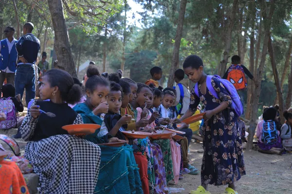 Children Enjoy Communal Meals Through Feeding Program