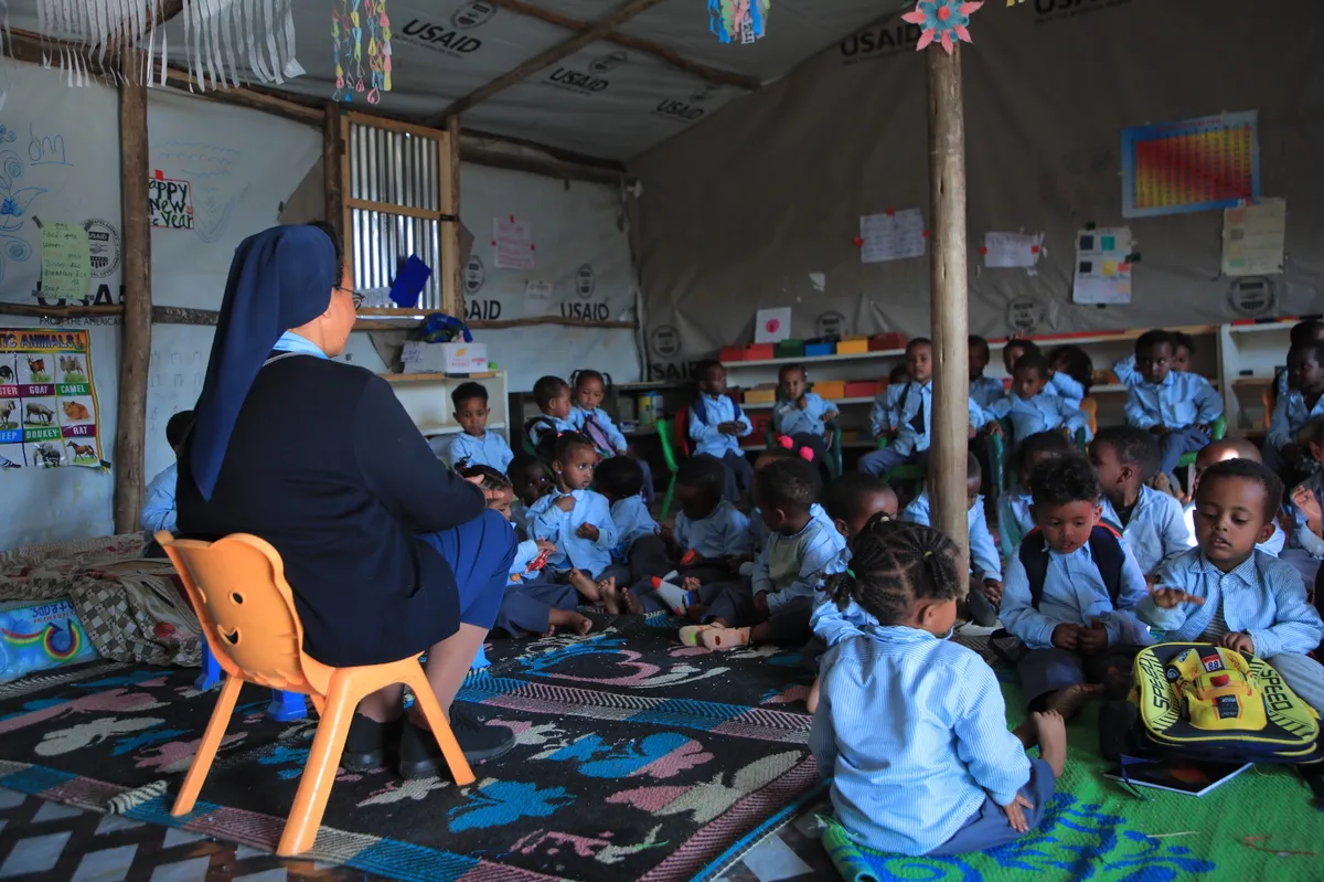 Sister Teaches Children in Temporary Classroom